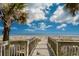 Wooden walkway provides easy access to the sandy beach and ocean at 1501 S Ocean Blvd. # 1048, Myrtle Beach, SC 29577