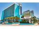 Striking Landmark Resort exterior featuring multiple floors, palm trees, and prime location close to the beach at 1501 S Ocean Blvd. # 1048, Myrtle Beach, SC 29577