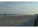 Oceanfront view with pier in the distance at 9 Gumwood Dr., Carolina Shores, NC 28467