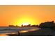 Oceanfront view at sunset with city skyline at 9 Gumwood Dr., Carolina Shores, NC 28467