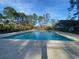 Large community pool with surrounding trees at 9 Gumwood Dr., Carolina Shores, NC 28467