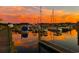 Peaceful marina view at sunset with boats and reflections at 9 Gumwood Dr., Carolina Shores, NC 28467