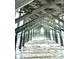 View from under the pier showing ocean waves at 9 Gumwood Dr., Carolina Shores, NC 28467