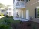 Backyard with patio, and partial view of neighboring building at 1147 Freeboard St. # 203, Murrells Inlet, SC 29576