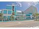 The Landmark Resort featuring vibrant turquoise and white facade against a bright blue sky at 1501 Ocean Blvd. S # 714, Myrtle Beach, SC 29577
