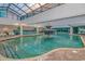 Indoor pool area featuring a decorative fountain and ample seating for guests at 1501 Ocean Blvd. S # 714, Myrtle Beach, SC 29577
