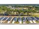 Bird's-eye view of a residential community with a golf course and lake in the backdrop at 546 Beckham Ct., Murrells Inlet, SC 29576