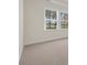 Bedroom featuring neutral carpet, white trim, and natural light at 546 Beckham Ct., Murrells Inlet, SC 29576