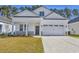 Inviting single-story home with a two-car garage and manicured front lawn at 546 Beckham Ct., Murrells Inlet, SC 29576