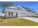 A charming single-story home featuring a well-manicured lawn and a two-car garage at 546 Beckham Ct., Murrells Inlet, SC 29576