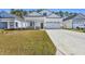 Beautiful single-story home featuring a well-manicured lawn and a concrete driveway at 546 Beckham Ct., Murrells Inlet, SC 29576