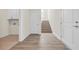 Hallway and stairwell with wood-look floors and white trim at 546 Beckham Ct., Murrells Inlet, SC 29576