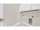 A bright laundry room with white cabinets and washer/dryer hookups at 546 Beckham Ct., Murrells Inlet, SC 29576