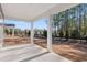 Covered back porch overlooking a grassy backyard with trees at 552 Beckham Ct., Murrells Inlet, SC 29576