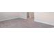 Empty bedroom with grey carpet and an open door at 552 Beckham Ct., Murrells Inlet, SC 29576