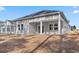 Gray house with a covered patio, surrounded by a yard at 552 Beckham Ct., Murrells Inlet, SC 29576