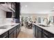 Modern kitchen with dark cabinetry, stainless steel appliances, and an island at 552 Beckham Ct., Murrells Inlet, SC 29576