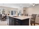 Kitchen island with seating, double sink, and white countertop at 552 Beckham Ct., Murrells Inlet, SC 29576