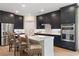 Modern kitchen with dark cabinets, stainless steel appliances and white quartz countertops at 552 Beckham Ct., Murrells Inlet, SC 29576