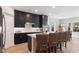 Modern kitchen featuring dark cabinetry, island, and stainless steel appliances at 552 Beckham Ct., Murrells Inlet, SC 29576