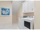 Bright laundry room with white cabinets and modern appliances at 552 Beckham Ct., Murrells Inlet, SC 29576