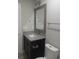 Bathroom boasts granite vanity, mirror, and modern fixtures at 1023 Meares St., Calabash, NC 28467