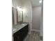 Bathroom with double vanity and granite countertop at 1023 Meares St., Calabash, NC 28467