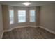 Bright bedroom with bay window and wood-look flooring at 1023 Meares St., Calabash, NC 28467