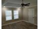 Spacious bedroom with ceiling fan and neutral decor at 1023 Meares St., Calabash, NC 28467