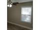 Bedroom with window, blinds, ceiling fan, and wood-look flooring at 1023 Meares St., Calabash, NC 28467