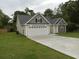 Two-car garage and neutral-toned exterior at 1023 Meares St., Calabash, NC 28467