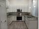 Modern kitchen with stainless steel appliances and granite countertops at 1023 Meares St., Calabash, NC 28467