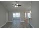 Open-concept living space with wood-look floors and sunroom at 1023 Meares St., Calabash, NC 28467