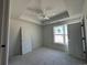 Bright bedroom featuring a tray ceiling with ceiling fan and neutral paint, awaiting your personal touches at 821 Rebecca Ln. # 6A, Myrtle Beach, SC 29577