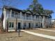 Charming two-story townhomes feature covered balconies, providing a welcoming curb appeal at 821 Rebecca Ln. # 6A, Myrtle Beach, SC 29577