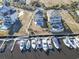 Aerial view of home on the marina, featuring a private dock with multiple boats at 1316 Marina Bay Dr., North Myrtle Beach, SC 29582