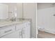 This bright bathroom features a white vanity with granite countertops and a walk-in shower at 1316 Marina Bay Dr., North Myrtle Beach, SC 29582