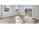 Bright bedroom with hardwood floors, neutral walls, and sliding glass door to balcony at 1316 Marina Bay Dr., North Myrtle Beach, SC 29582