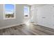 The bedroom has two windows that provide ample natural light and wood-look flooring at 1316 Marina Bay Dr., North Myrtle Beach, SC 29582