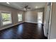 Spacious bedroom with dark hardwood floors and large windows at 1316 Marina Bay Dr., North Myrtle Beach, SC 29582