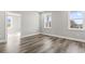 Bright bedroom with hardwood floors, neutral walls, and large windows allowing ample natural light at 1316 Marina Bay Dr., North Myrtle Beach, SC 29582