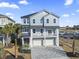 Stunning three-story home with a metal roof, double balconies, two-car garage and beautiful curb appeal at 1316 Marina Bay Dr., North Myrtle Beach, SC 29582