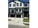 Two story home with white siding and black accents at 1316 Marina Bay Dr., North Myrtle Beach, SC 29582