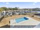 Aerial view of a backyard with a pool and a marina in the background at 1316 Marina Bay Dr., North Myrtle Beach, SC 29582