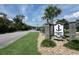 The Marina Bay community sign is surrounded by lush greenery, stones and a well-manicured lawn at 1316 Marina Bay Dr., North Myrtle Beach, SC 29582