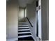 Modern staircase with dark wood treads and white risers at 1316 Marina Bay Dr., North Myrtle Beach, SC 29582