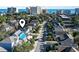 Aerial view of the home and surrounding neighborhood with palm trees at 410 5Th Ave. S, North Myrtle Beach, SC 29582