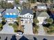 Aerial view of a new construction home with three-car garage and long driveway at 410 5Th Ave. S, North Myrtle Beach, SC 29582