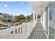 Balcony view of the neighborhood and street with palm trees and other homes at 410 5Th Ave. S, North Myrtle Beach, SC 29582