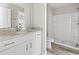 Bathroom with white cabinets, granite countertops, and a walk-in shower at 410 5Th Ave. S, North Myrtle Beach, SC 29582